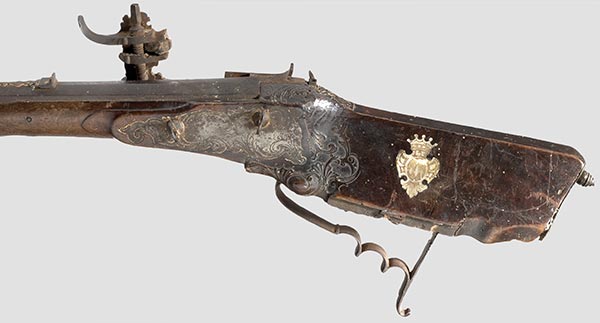 A pair of model cannons, German, circa 1700. Bronze barrels in several  sections with hoop structure and reinforced muzzles. Side mounted  trunnions. There are two sculpted hooks in the shape of dolphins